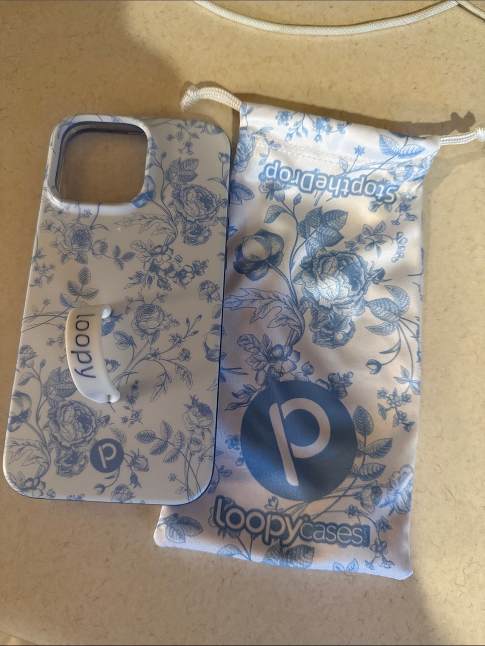 Loopy Case White Phone Case with Blue Floral Design and Grip 16 pro max
